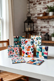Colorful patterned square magnets on a white table with a kitchen background