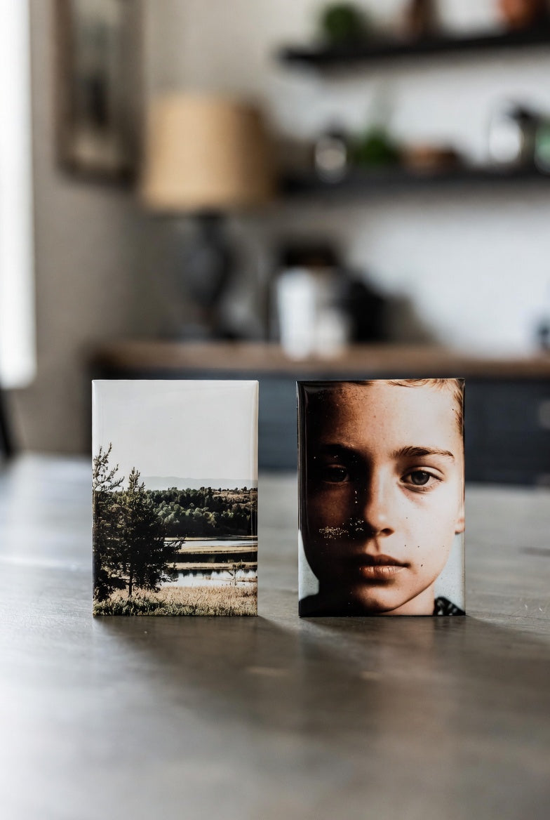 Two 2x3 Magnets on a surface with a blurred background in a room