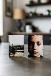 Two 2x3 Magnets on a surface with a blurred background in a room