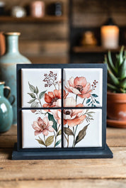 Four floral Custom Puzzle Magnet Set 2x2 on a stand with a wooden background