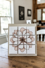 Floral design of a Custom Puzzle Magnet Set 3x3 on a wooden panel in a room with chairs and a window.