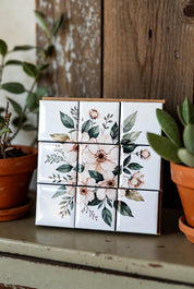 Custom Puzzle Magnet Set 3x3 of flowers on a wooden surface with plants in the background